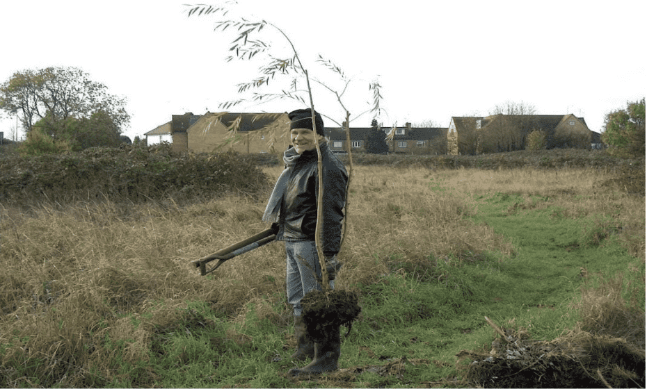 Wayne Armsby planting a young tree on Long Lane Pasture